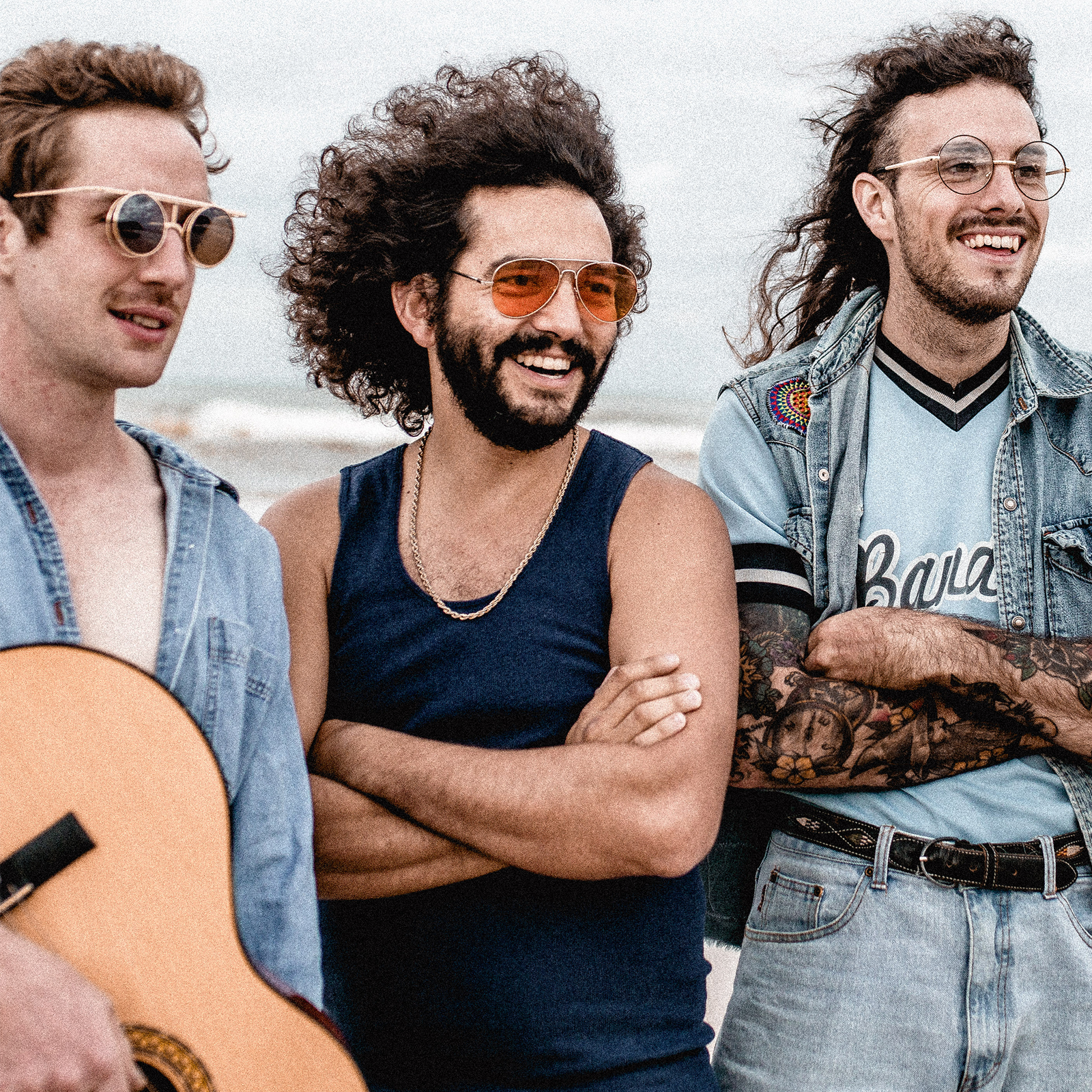 Group of three men wearing sunglasses